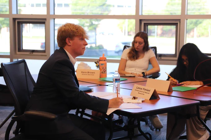 The Shapiro Administration welcomed 10 Pennsylvania college students with disabilities to the 2025 Office of Vocational Rehabilitation (OVR) summer internship program. Photo of interns taking notes during orientation.