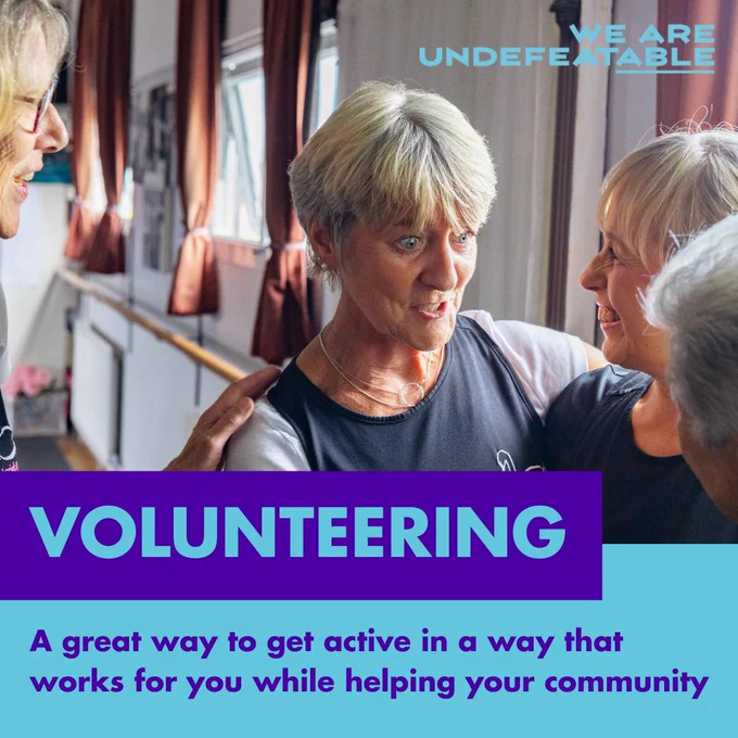 Graphic for 'We Are Undefeatable' featuring three individuals smiling and interacting in a fitness setting, with text overlay reading 'Volunteering - A great way to get active in a way that works for you while helping your community'