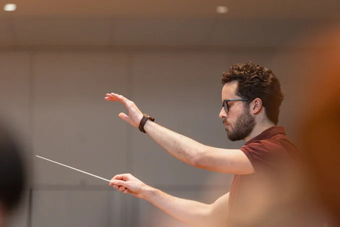 Close up shot of a conductor conducting