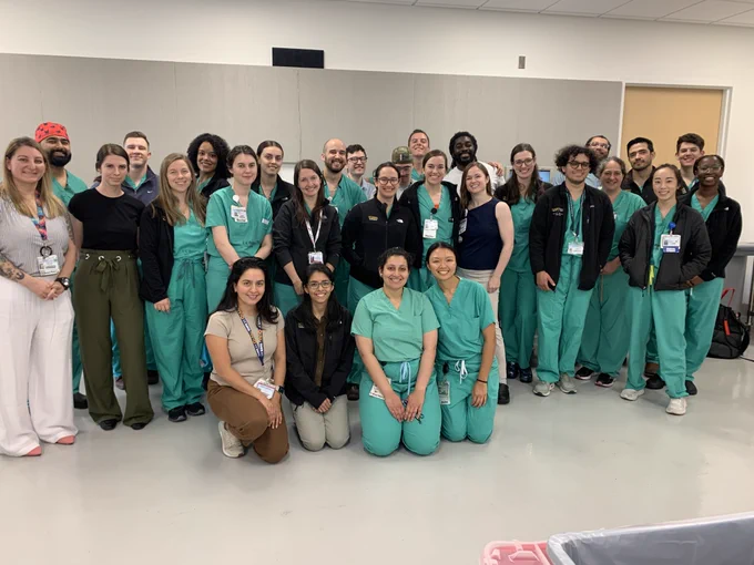 Surgery residents pose after the completion of the General Surgery Simulation Olympics event.