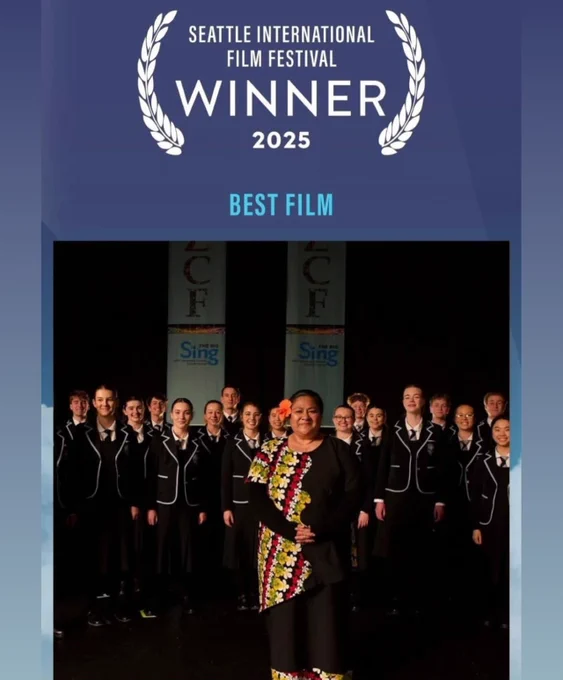 Blue poster with white text that says Seattle International Film Festival Winner 2025 BEST FILM with a picture of Anapela Polata'ivao standing in front of a choir of students from the movie.