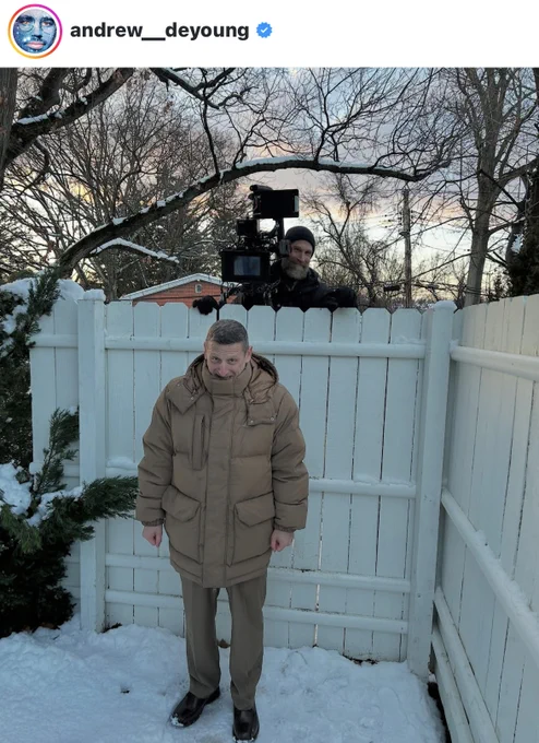 Picture of Andrew Deyoung's IG post with Andy (cinematographer) looking over a white fence at the main character of the Movie Friendship
