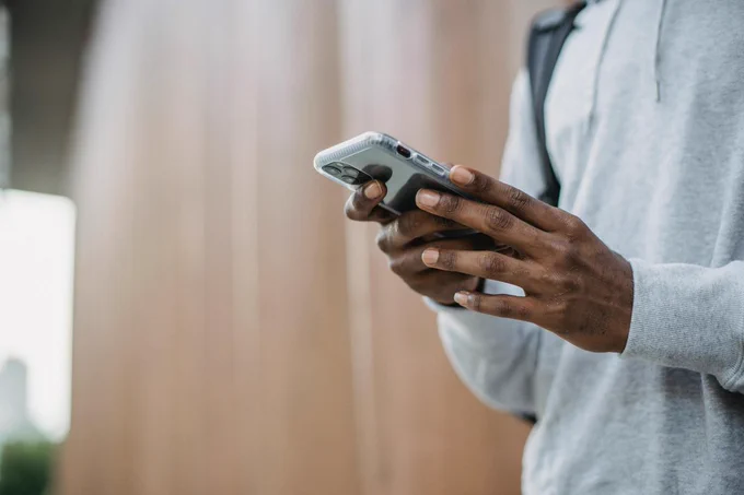 Anonymous person holds smartphone