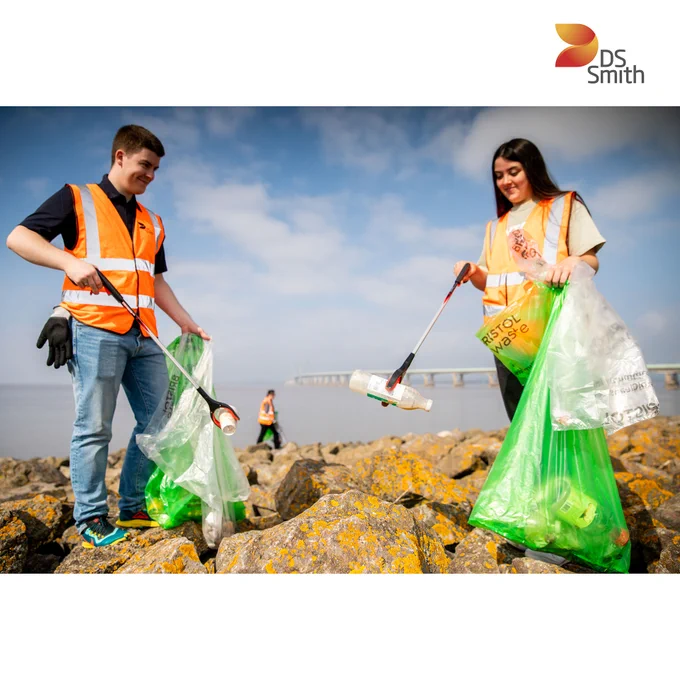 Two people in hi-vis picking up litter 