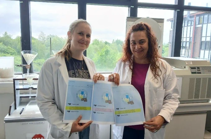 Technicians, Katy Flowers and Dr Marta Perez-Fernandez, with LEAF certificates for their labs in the Department of Geography.