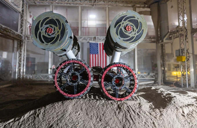 NASA’s RASSOR (Regolith Advanced Surface Systems Operations Robot) conducts excavation testing of simulated regolith, or lunar dust found on the Moon’s surface, inside of the Granular Mechanics and Regolith Operations Lab at the agency’s Kennedy Space Center in Florida on Tuesday, May 27, 2025. RASSOR is designed to work in low-gravity situations, using counter rotating bucket drums on each arm to collect and dump regolith for the extraction of hydrogen, oxygen, or water, resources critical for sustaining a habitable presence. Photo credit: NASA/Frank Michaux