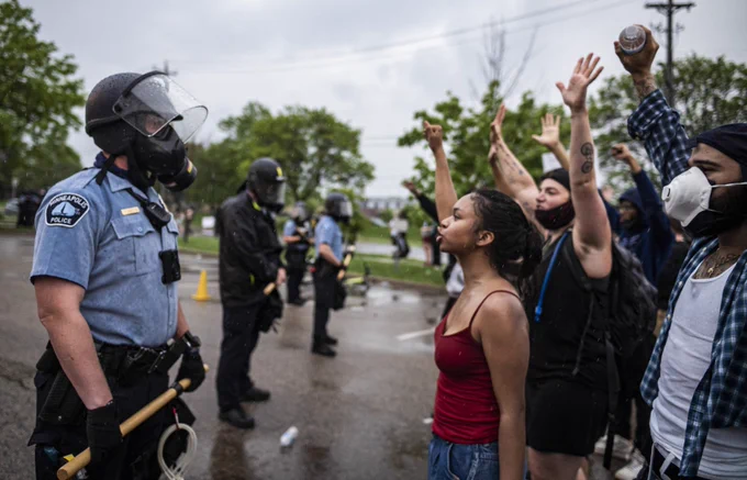 Protesters and police face each other during a rally for George Floyd in Minneapolis on Tuesday, May 26, 2020