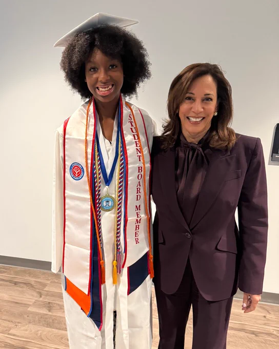 Vice President Kamala Harris takes a photo with Compton High School graduating senior Myshay Causey.