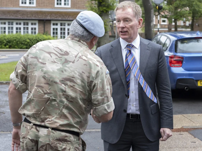 Major General Paul Tedman shaking hands with Sir Chris Bryant MP. 
