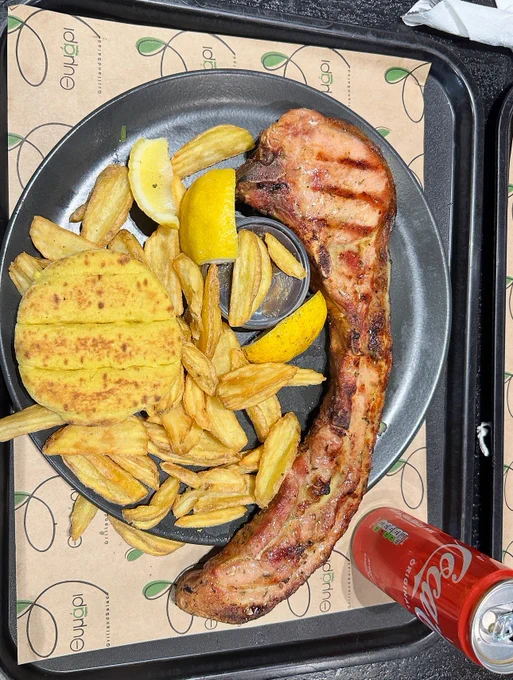 Giant Cypriot Pork Chop 😋 Let us know if you have ever had one?