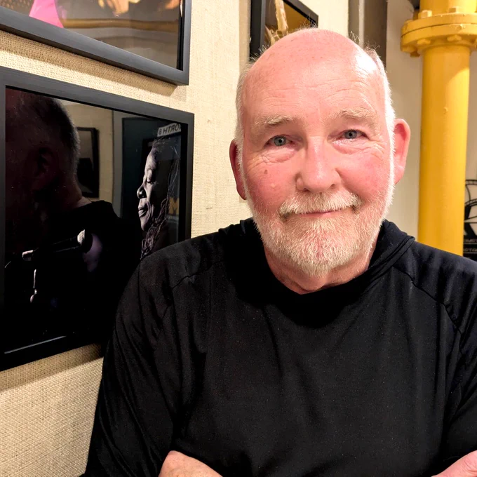Jeff Dunn at the Argus Museum next to his photo of Linda Hale. Photo by Christopher Porter.