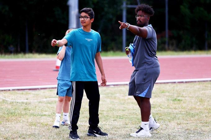  A Tottenham Hotspur Foundation coach engages with young participants at Great Ormond Street Hospital’s Sports Day.