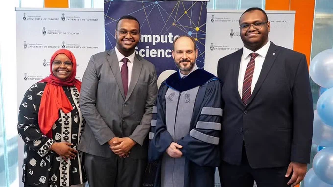 The Alims are joined by Eyal de Lara, chair of the department of computer science, at a graduation reception