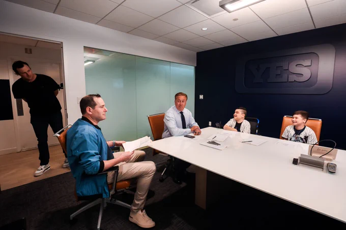 Gerrit Cole surprises Carmine and Vincent Gagliano at the YES Network Studios during a pregame production meeting. 
