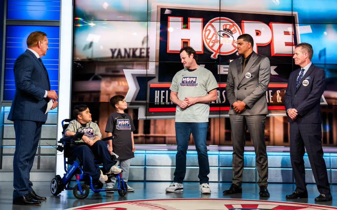 Gerrit Cole talks to Carmine and Vincent Gagliano at the YES Network Studios. 