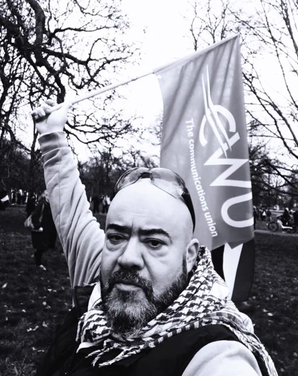 Fevzi holding a CWU flag