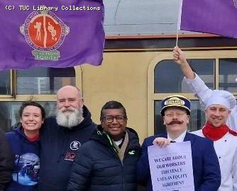 Photo of Ian and other Equity activists at a demonstration infront of a train