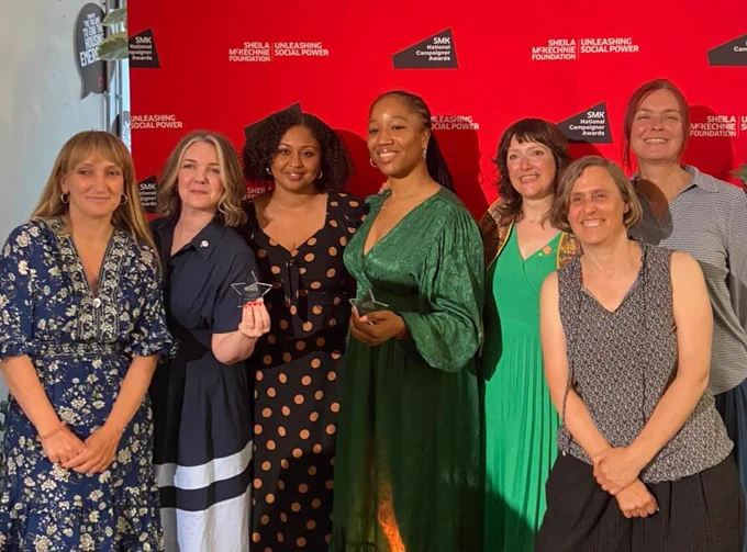 Women from the winning campaign groups with their awards