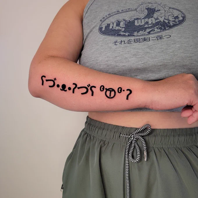 blackwork bear ascii art tattoo by spoopy on someone's forearm
