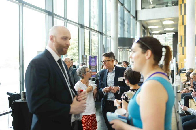 Conference attendees mingling