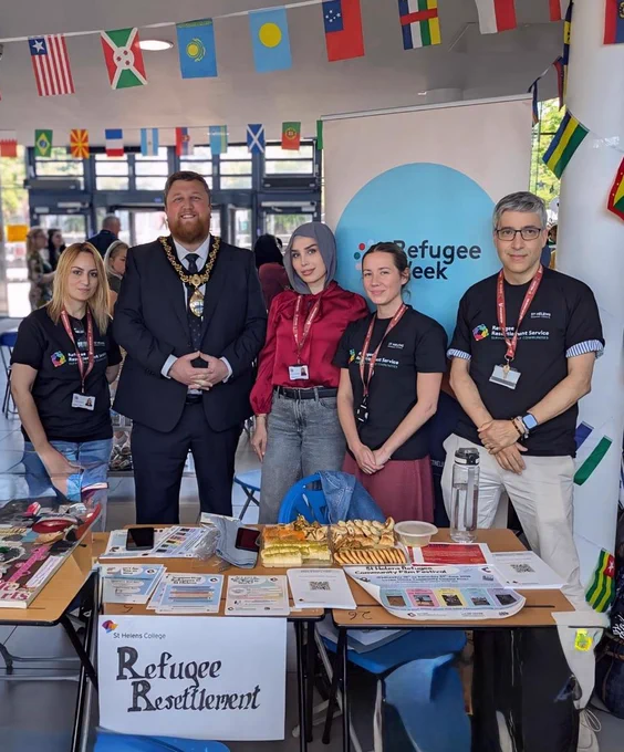 Mayor of St Helens Borough, Cllr Seve Gomez-Aspron, pictured with Refugee Resettlement Service at St Helens College Refugee Week event