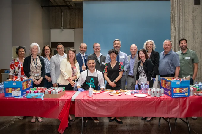 A photo showing all 15 upper management people that volunteered for the National Public Service Week event. 