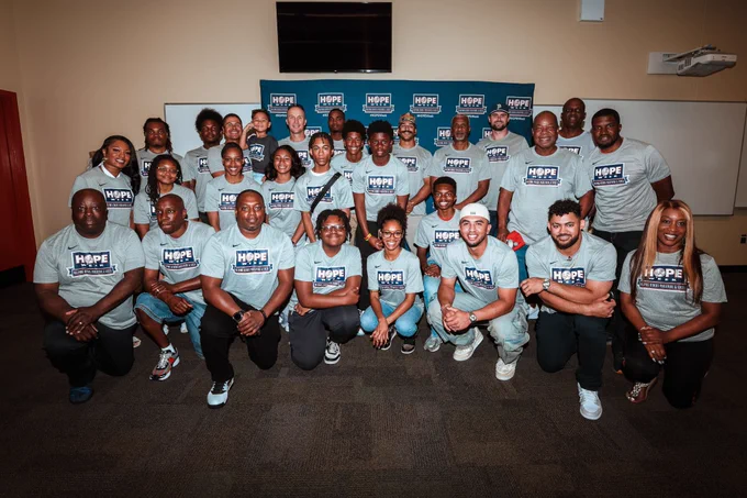 Yankees Players and Coaches with NYMBPA volunteers and local students interested in aviation at Vaughn College. 