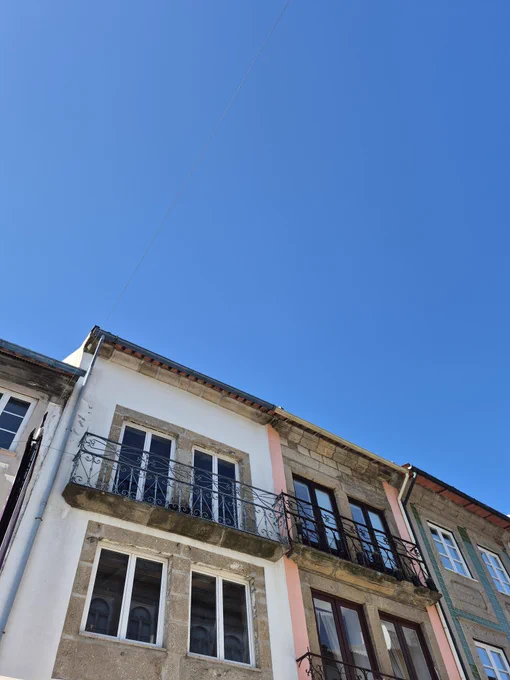A photo of a blue sky and buildings