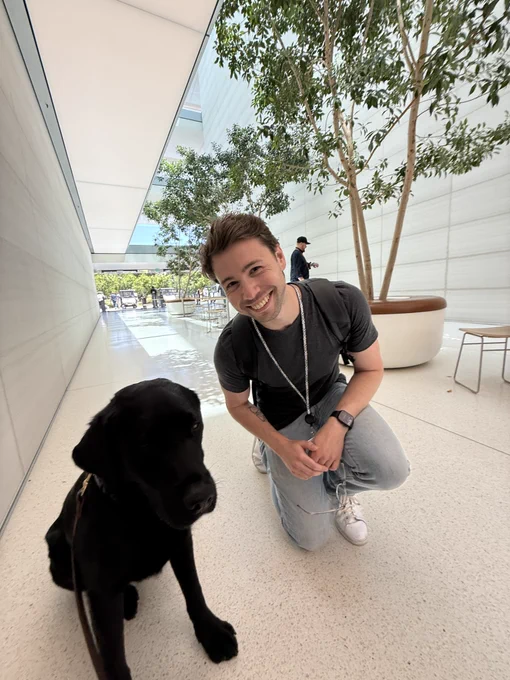 Photo of Aled posing with a security dog. Beautiful.