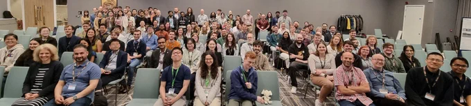 A group photo of all the participants, seated in front and standing at the back.