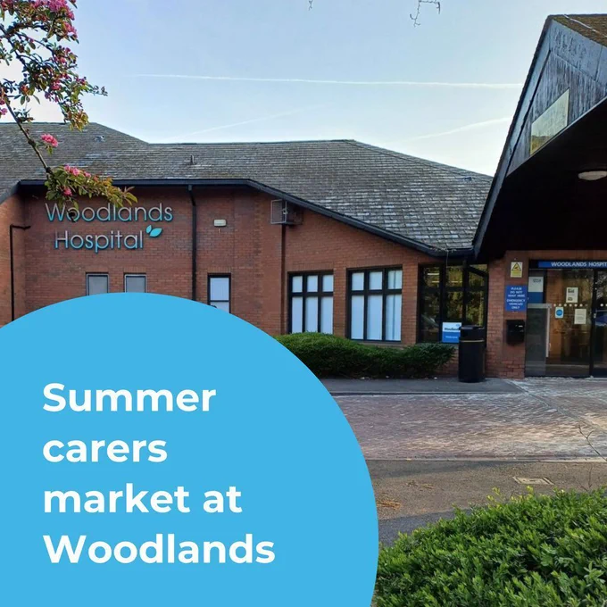 The exterior of a building with a sign that reads "Woodlands Hospital." There is a blue circular overlay in the bottom left corner with white text that says, "Summer carers market at Woodlands."