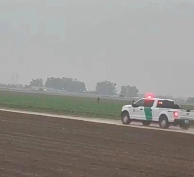 Border patrol truck coming into Oxnard fields where farm workers are laboring