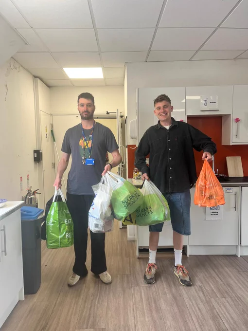 Team CTS holding carrier bags full of Wish List donations from corporate partner One Family
