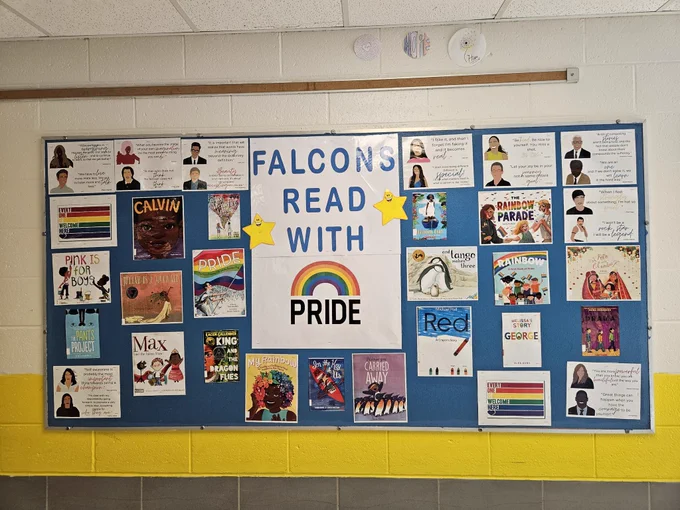 Read with Pride bulletin board featuring picture books.