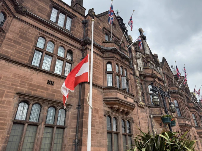 A picture of the Austrian flag outside the Council house