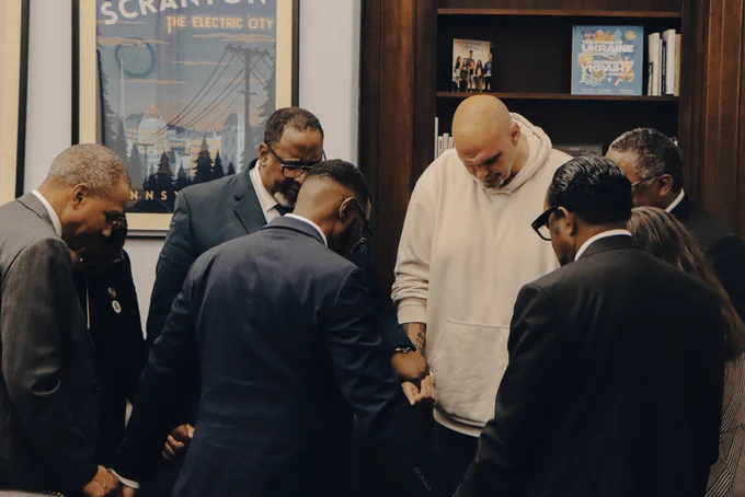 Surrounded by religious leaders from Pennsylvania and across the country, Senator Fetterman and the group bow their heads in a circle of prayer.