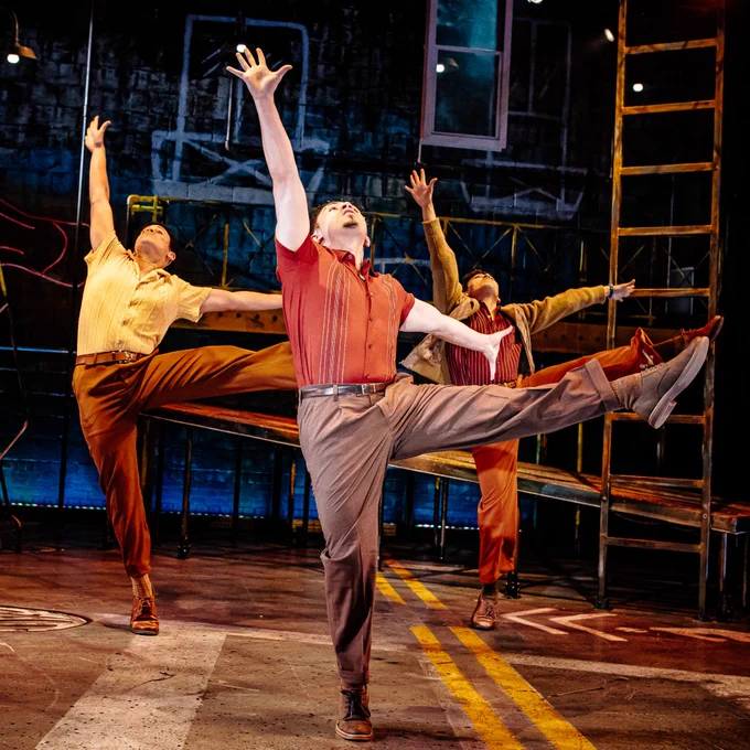 Three dancers in West Side Story.