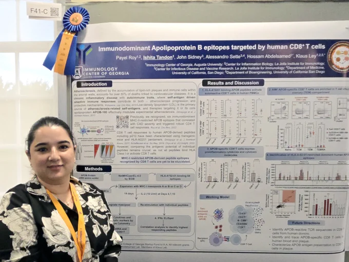 Woman with poster and award