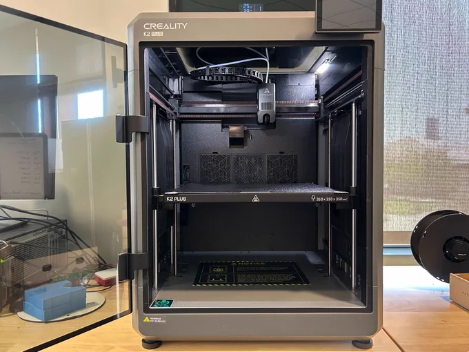 Creality K2 Plus with its door open.