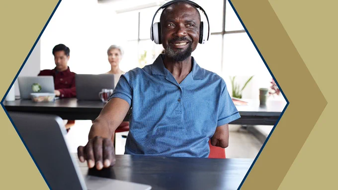 A person with a physical disability using a computer. 
