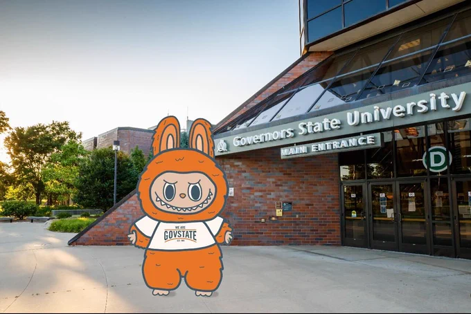 Illustration of a Governors State University's Labubu doll in front of the main entrance of the university building during sunset.