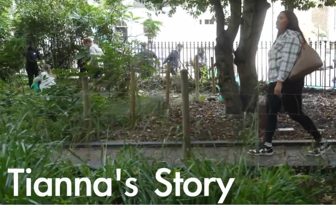 a screenshot of the opening scene to Tianna's story. You see a young woman walking through a park with the words "Tianna's Story"