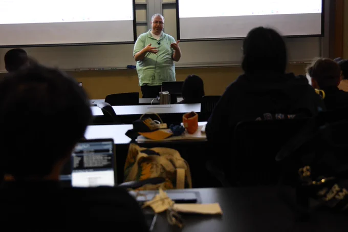 Professor instructing class.