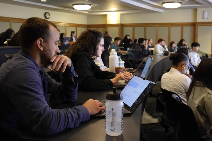 Students looking at computer screens.