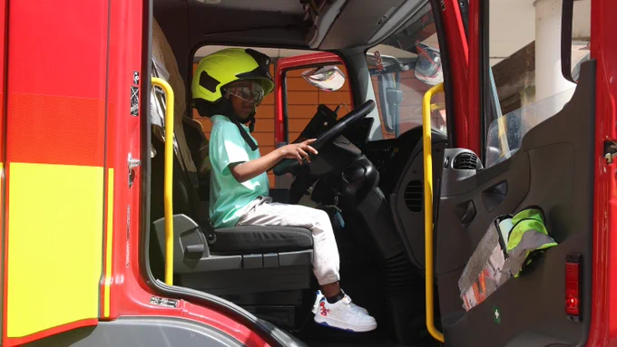 Boy in a fire engine at Evelina London Children's Hospital 