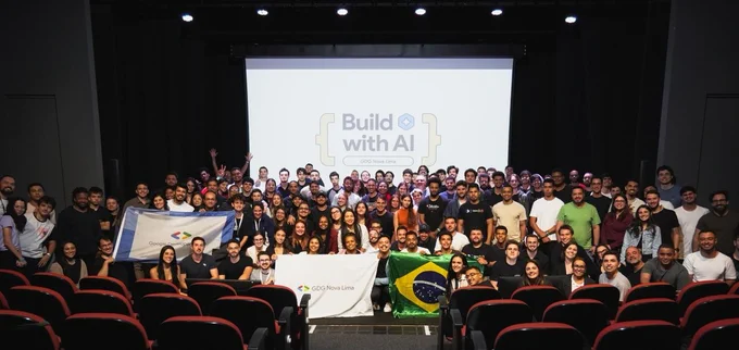 Group of attendees pose for picture at a GDG Build with AI event hosted in Nova Lima.