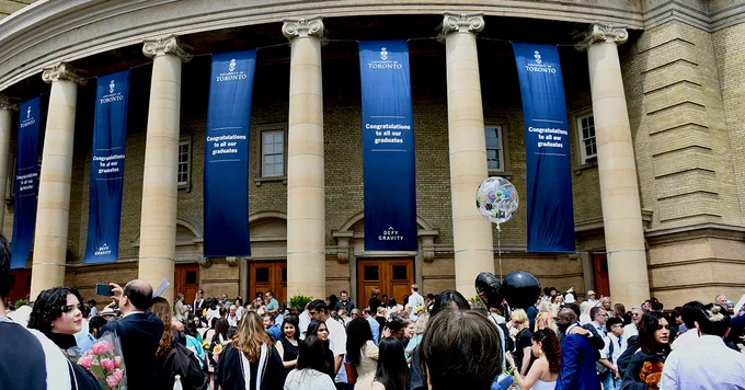 A crowd of people in front of Convocation Hall