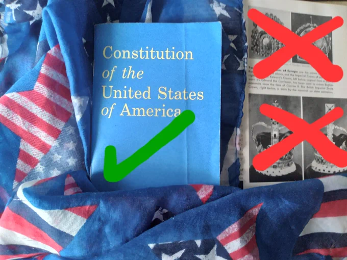 a small Constitution of the United States of America booklet with a green checkmark across the bottom; booklet nestled against a scarf with a red, white & blue stars and stripes pattern; all that to the left of an encyclopedia page showing 4 ornate crowns with 2 red X marks on them 