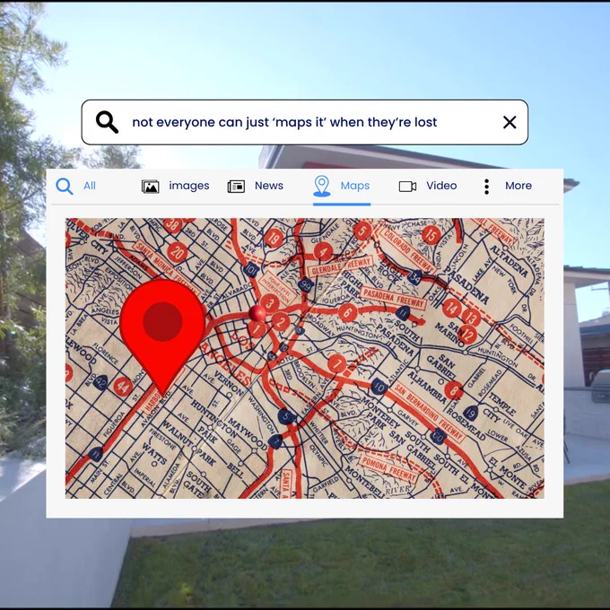 A screenshot of a digital map search result on a screen, with a large red location pin. The text reads "not everyone can just 'maps it' when they're lost.