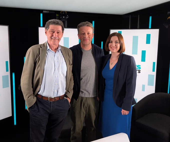 Jon Sopel, Jamie Oliver and Bridget Phillipson stand together in the News Agents’ studio.